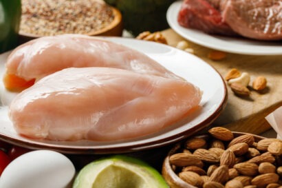 fresh raw chicken breasts on white plate near nuts 2024 11 09 12 37 56 utc